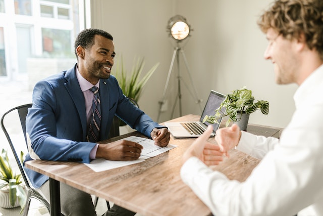 accountant-and-client-speaking-while-sitting-at-desk | Specialized Memphis