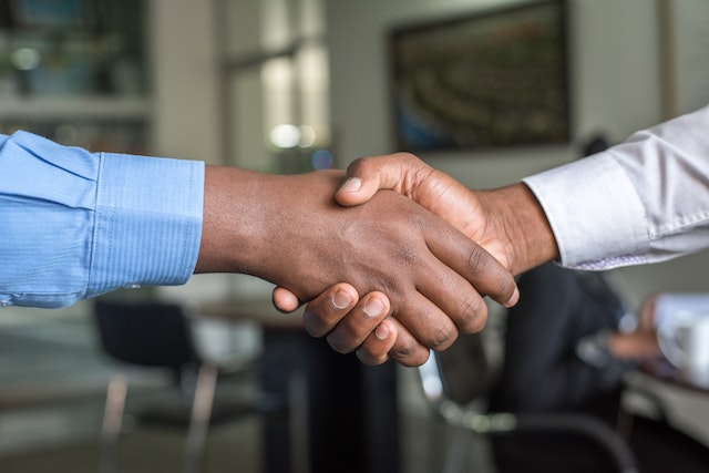 investor-and-property-manager-shaking-hands-over-desk | Specialized Memphis