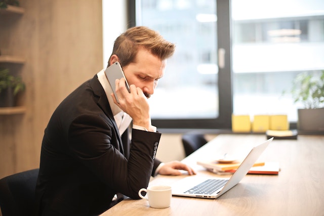 property-manager-on-phone-sitting-at-desj | Specialized Memphis
