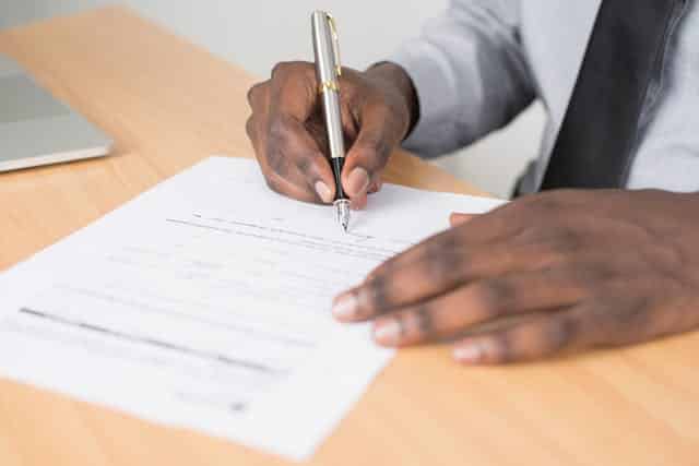 pexels-cytonn-955389 | Specialized Memphis person signing a document