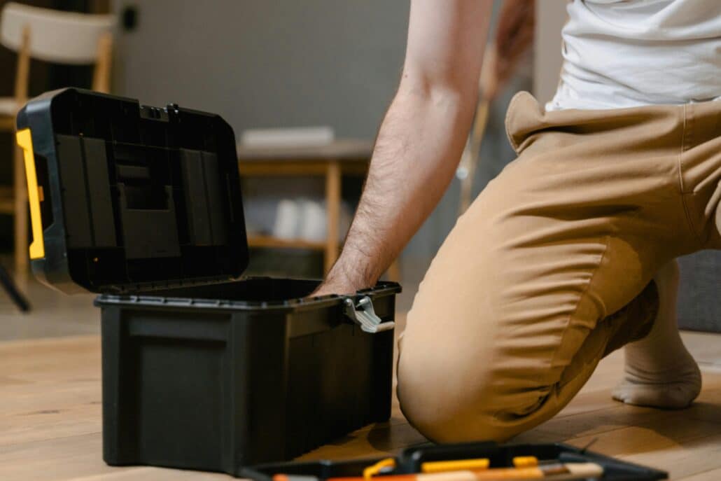 pexels-mart-production-7491192 8 | Specialized Memphis someone kneeling down and reaching into a toolbox