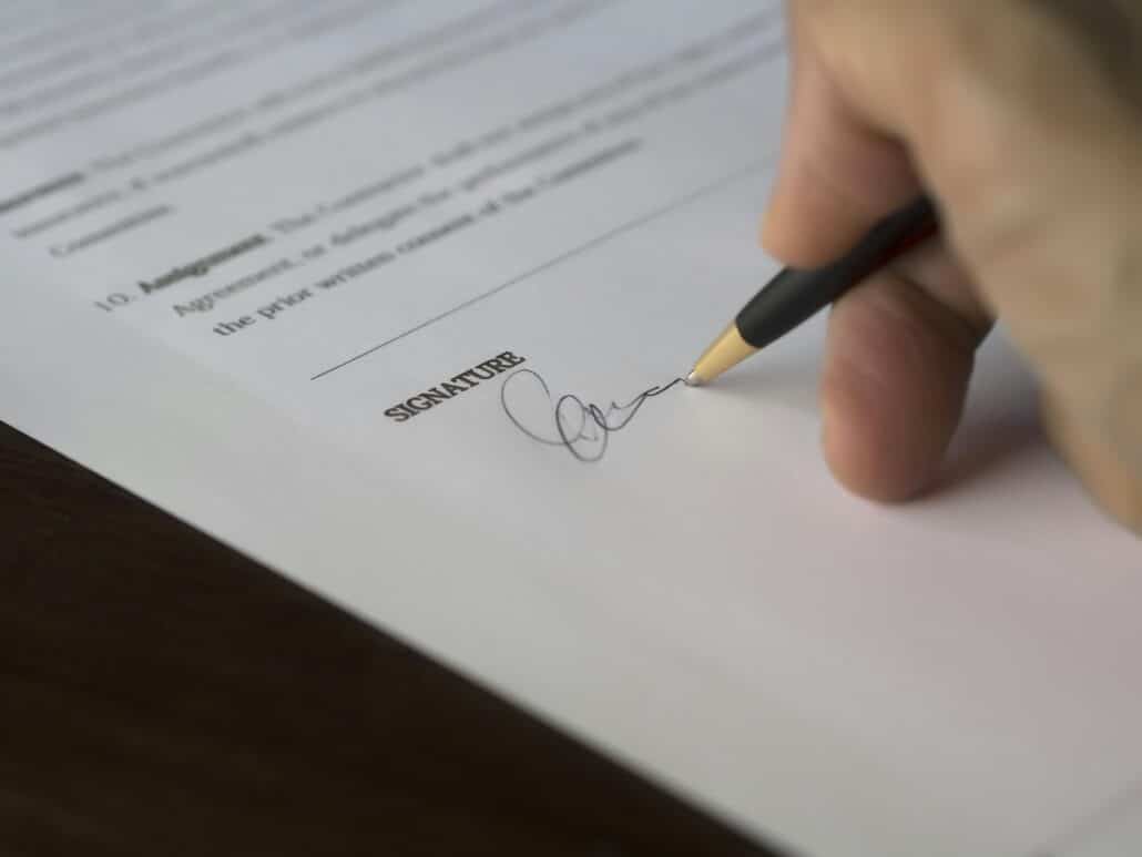 pexels-pixabay-261621 2 | Specialized Memphis someone signing a contract