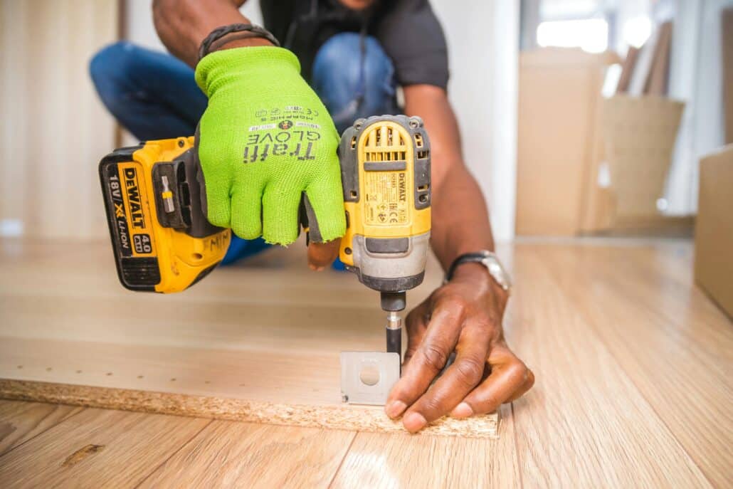 pexels-bidvine-517980-1249611 2 | Specialized Memphis man drilling into wooden planks on the floor