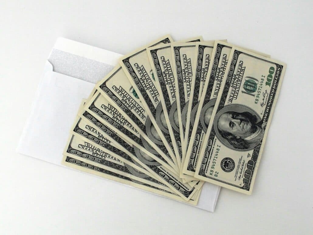 pexels-pixabay-534229 41 | Specialized Memphis cash fanned out over a white envelope