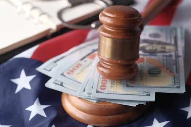Close up of Banknotes and a Gavel | Specialized Memphis Close up of Banknotes and a Gavel